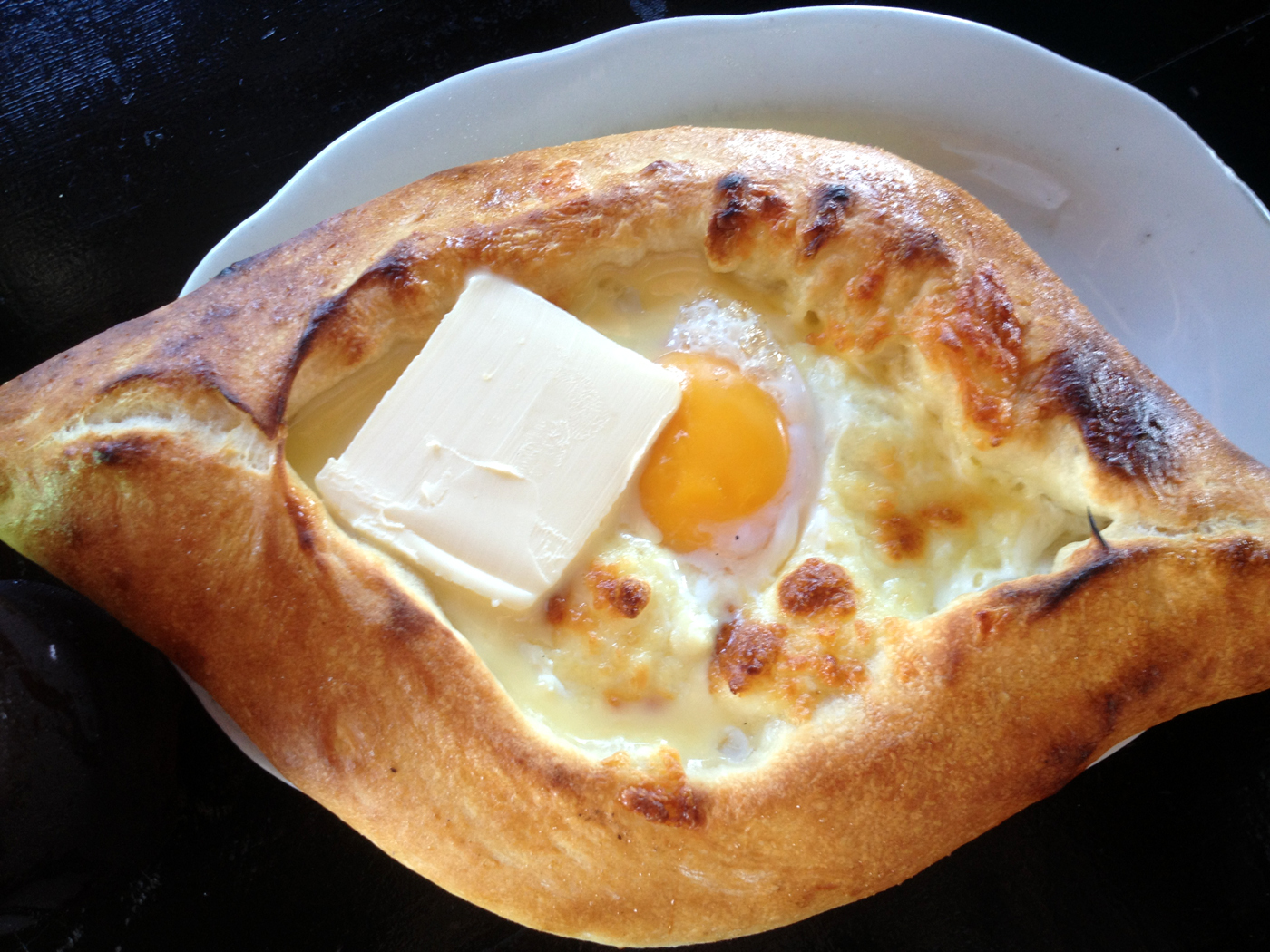 On the photo Georgian khachapuri Georgian khachapuri