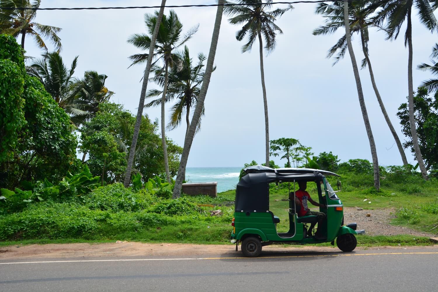 Green tuk-tuk on Sri Lanka road Photo: tuk-tuk