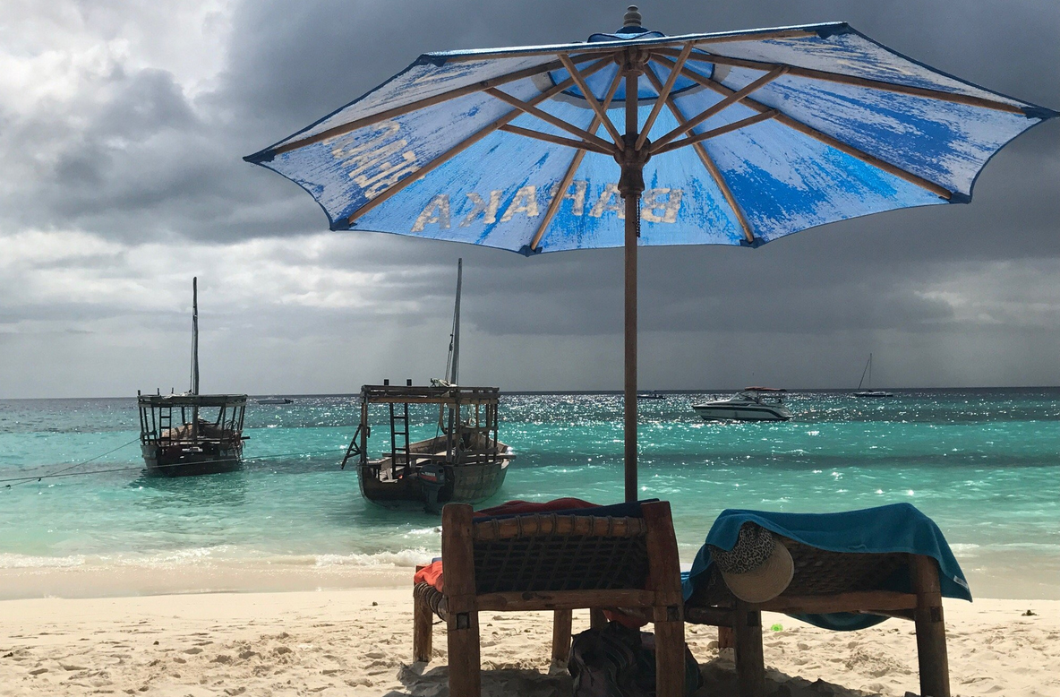 Photo of a sunbed with an umbrella on Nungwi beach Nungwi beaches have sun beds with umbrellas