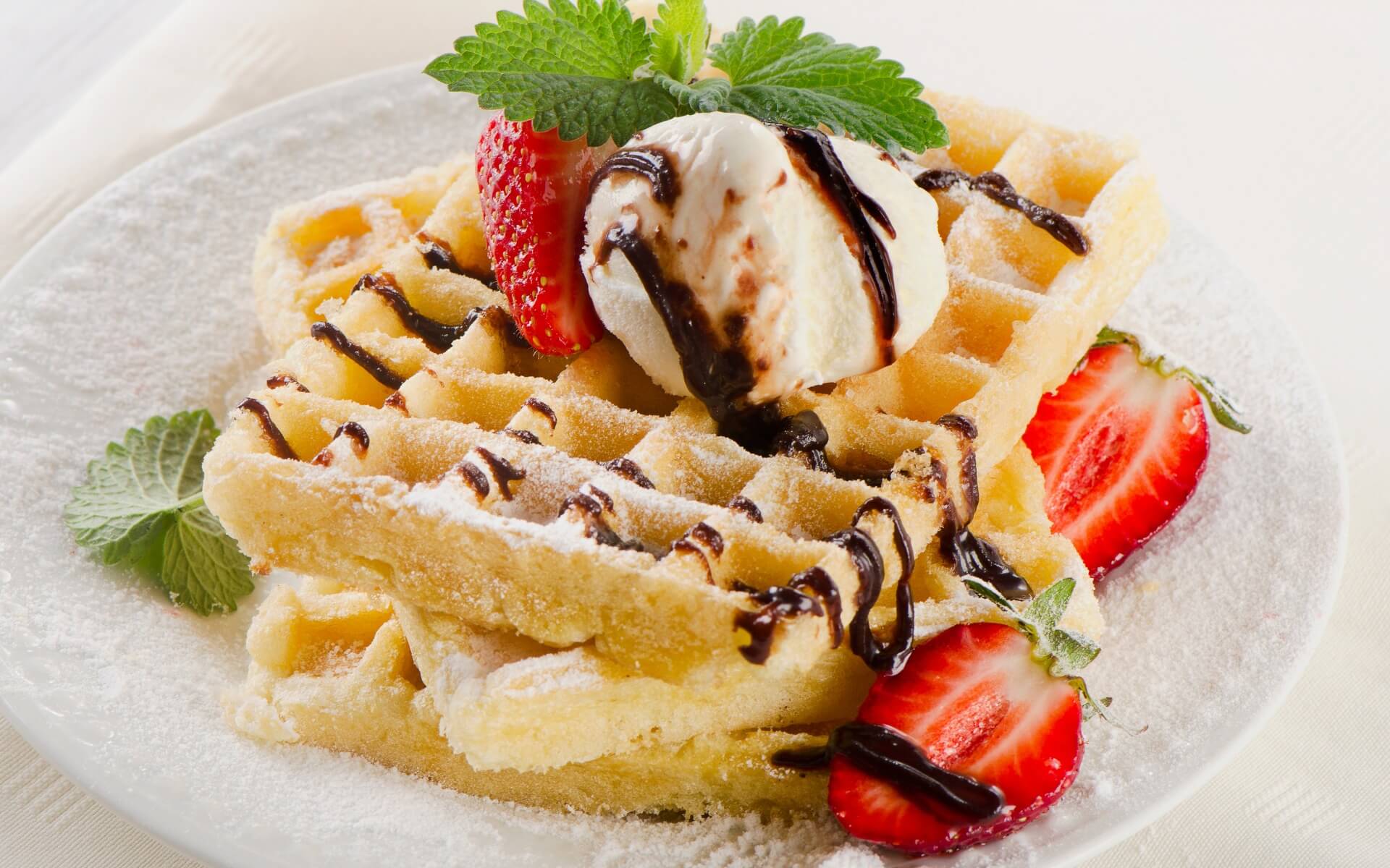 Dessert-Belgian waffles with ice cream and strawberries Belgian waffles with ice cream and strawberries