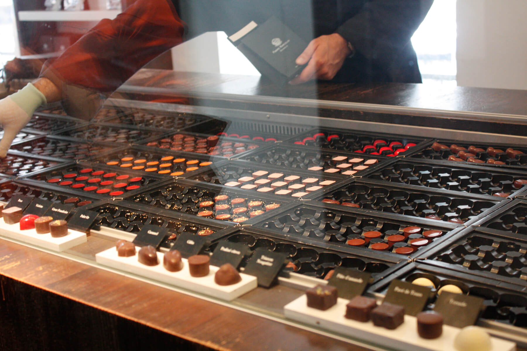 Photo of a showcase with chocolate in the Pierre Marcolini store Showcase in the Pierre Marcolini store