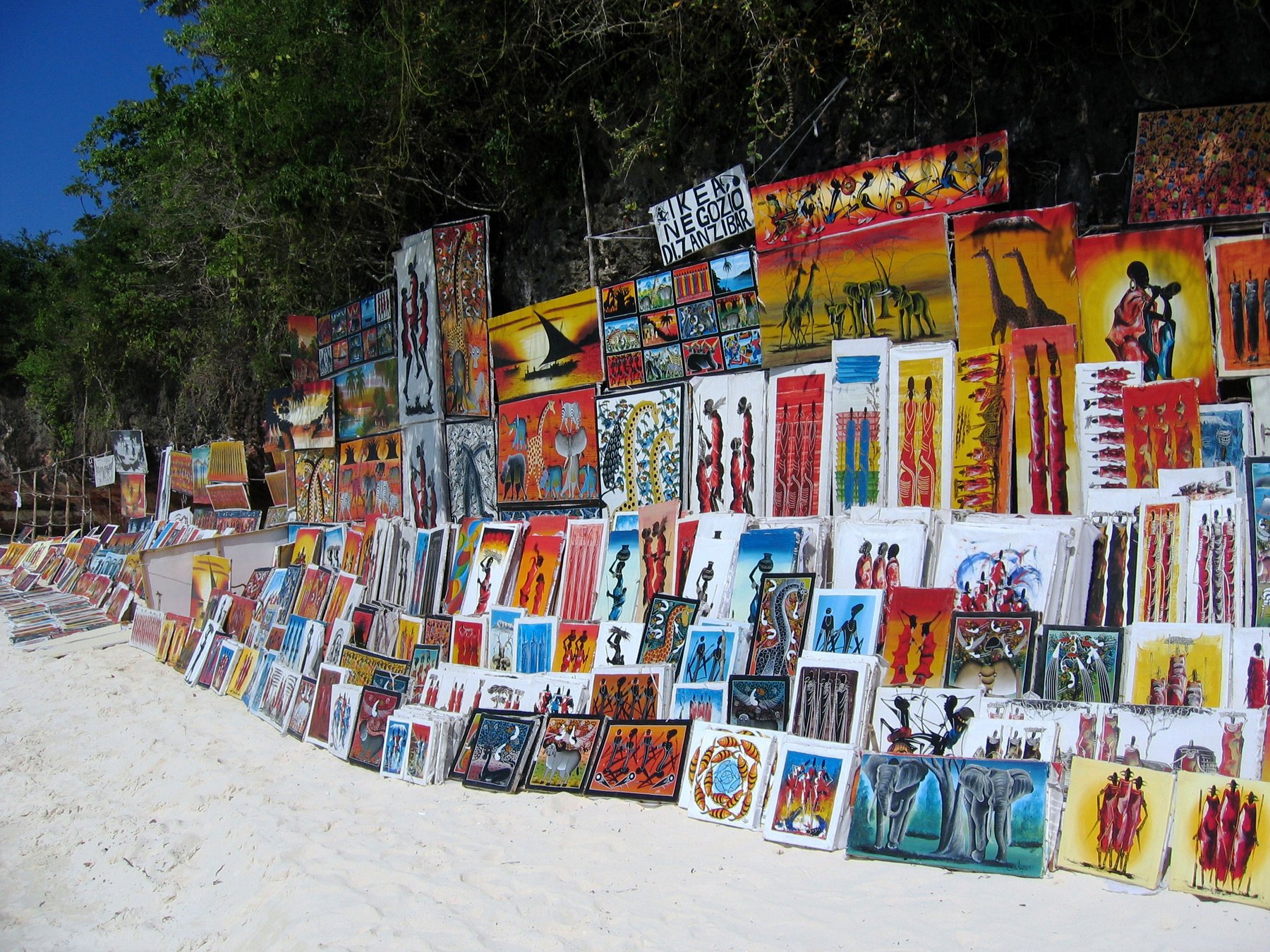Tingating paintings at the Zanzibar market Paintings in the style of Eduardo Tingtinga