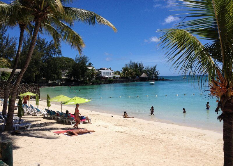 Vacationers at Perebeyré Beach in Mauritius Pereybere Beach