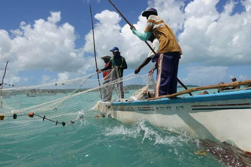 Locals fish from boats on Rodriguez Local fishermen