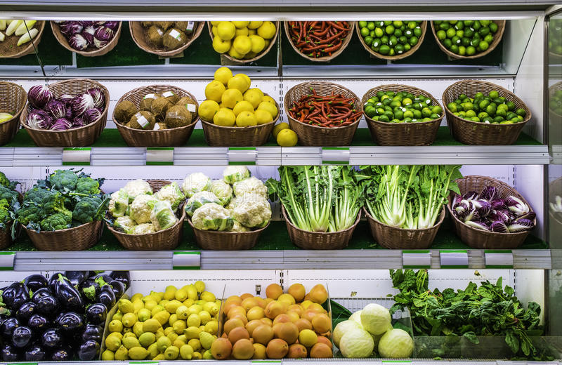 Vegetables and fruits on the supermarket counter Vegetable shelf in a supermarket