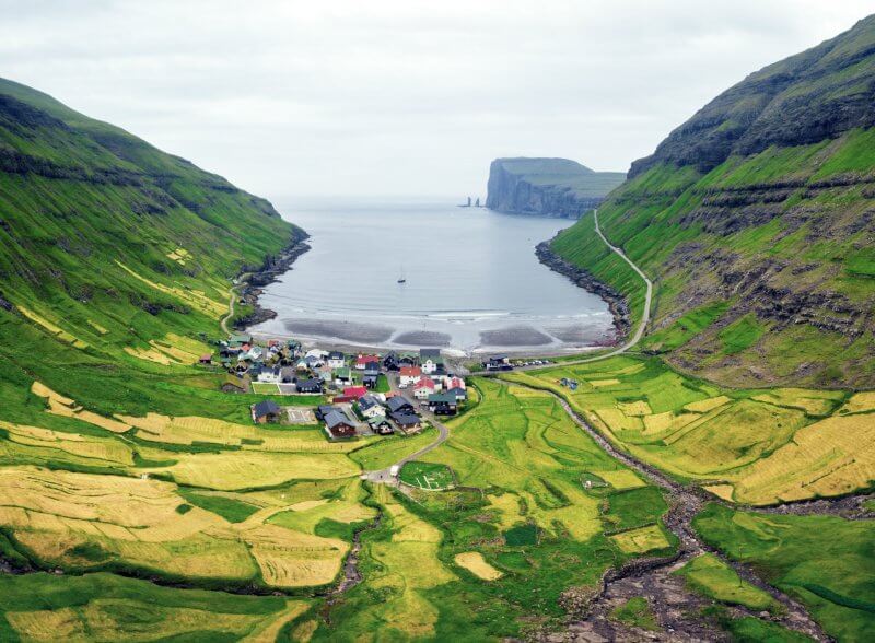 View of the sea and the village of Chødnuvøk in the Faroe Islands The village of Chödnovuik on Streymoy Island
