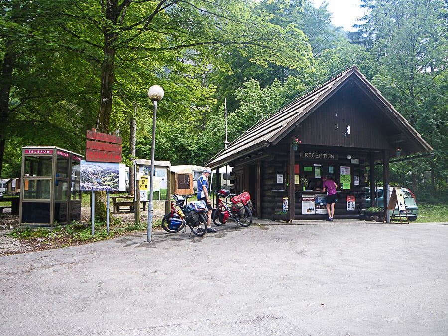 Photo of the camping reception near the bus stop before turning onto Vogel Camping in the southwestern part of Lake Bohinj in front of Ukanc