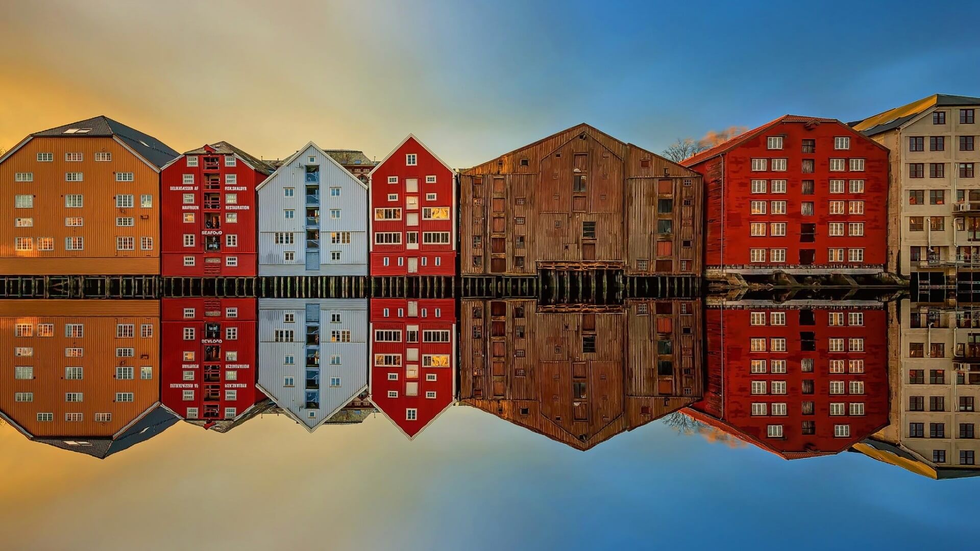 Colorful wooden houses in the city of Trondheim, on the eastern bank of the Nidelva River Colorful wooden houses