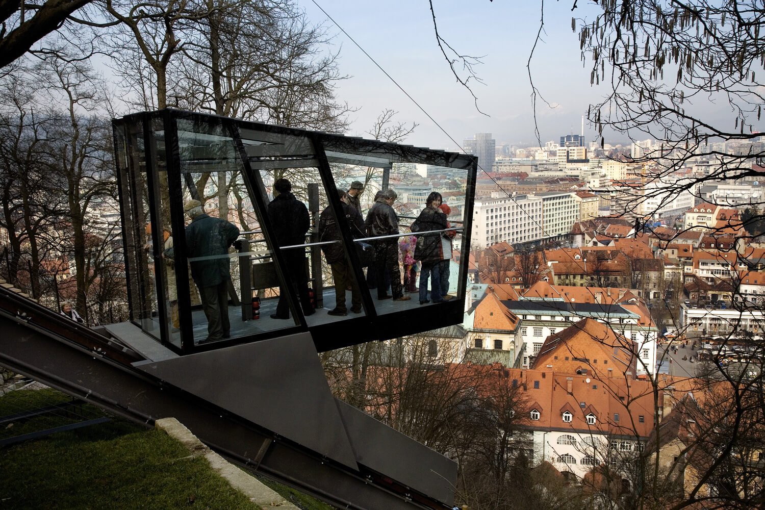 Photo of a funicular with a fully glass cabin Funicular to the castle