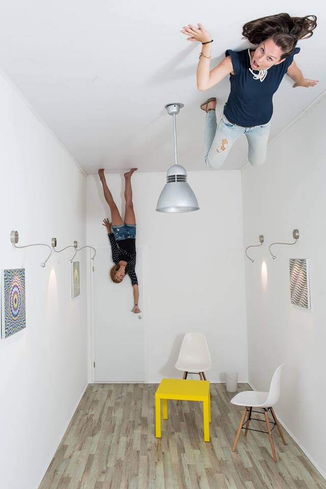 Photo of a room upside down in the Museum of Illusions Room upside down