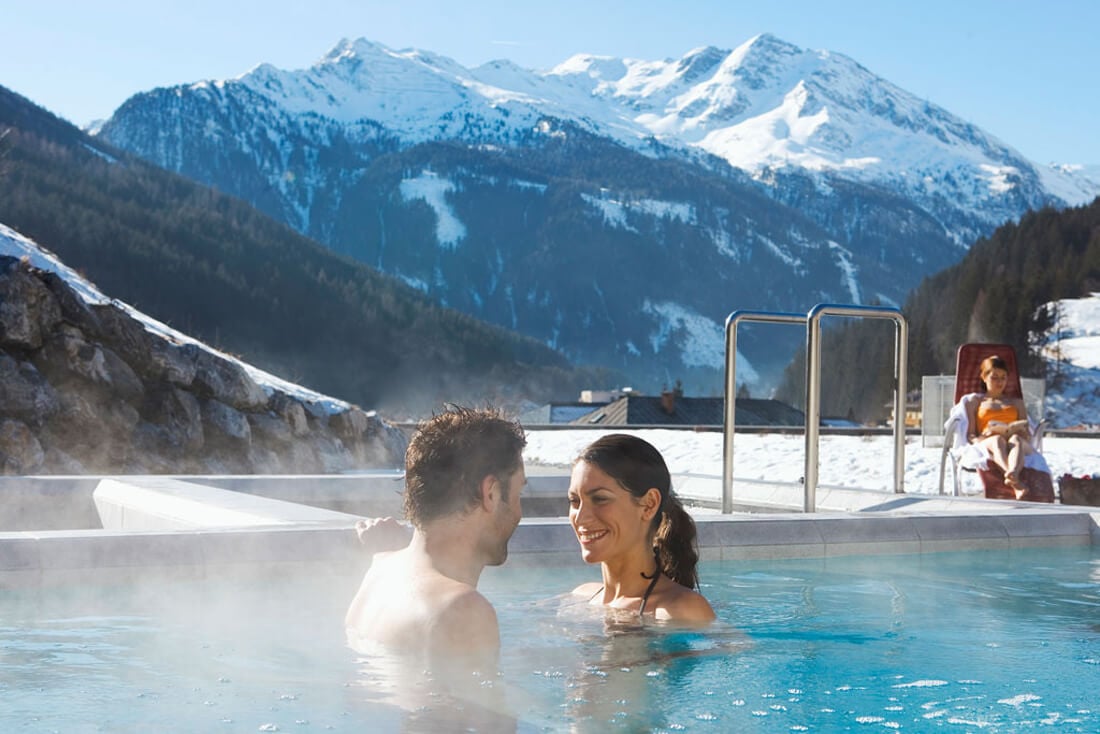 A couple in a thermal spring pool at the Bad Gastein resort Thermal Springs of Bad Gastein