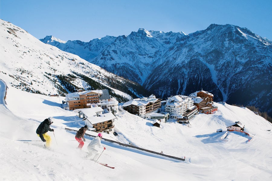 Skiers are descending the slope in the village of Hochselden Trails lead directly to the hotel